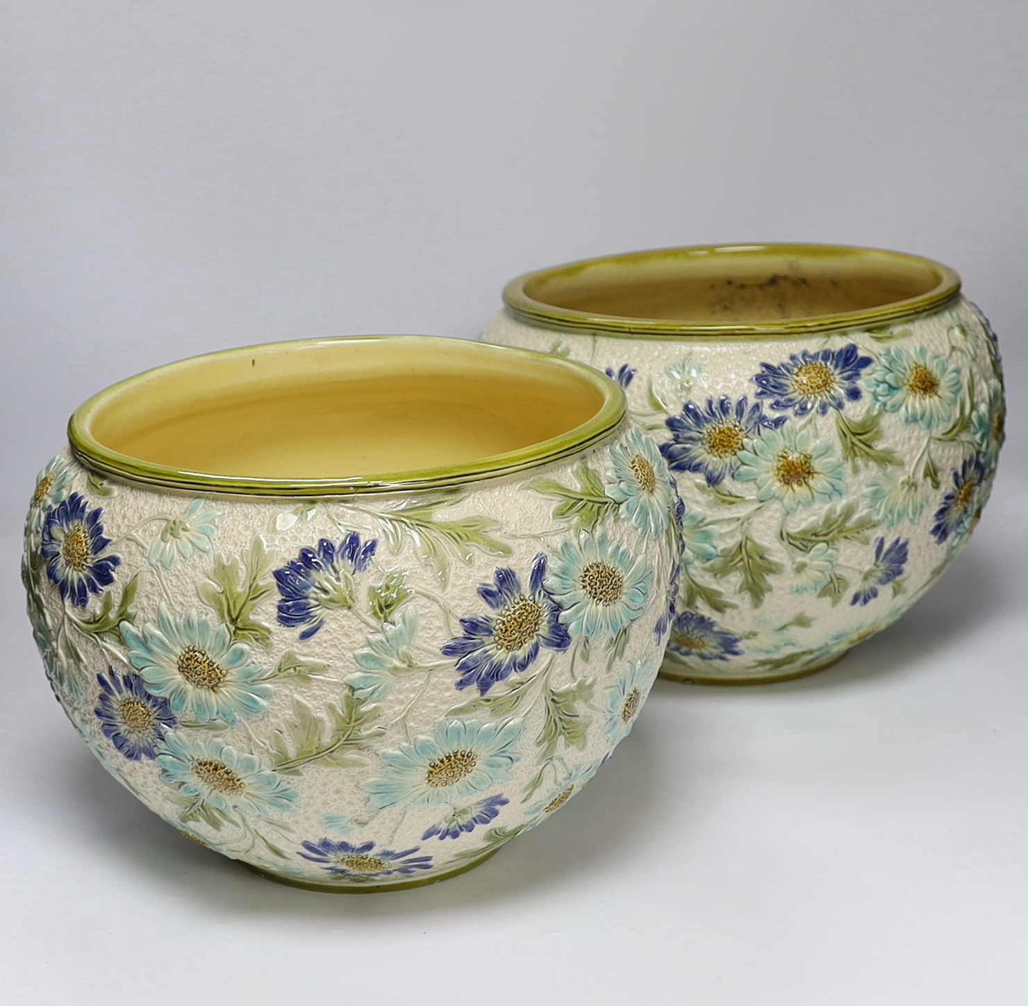A pair of Burmantofts faience floral jardinières, c.1900, 23cm high